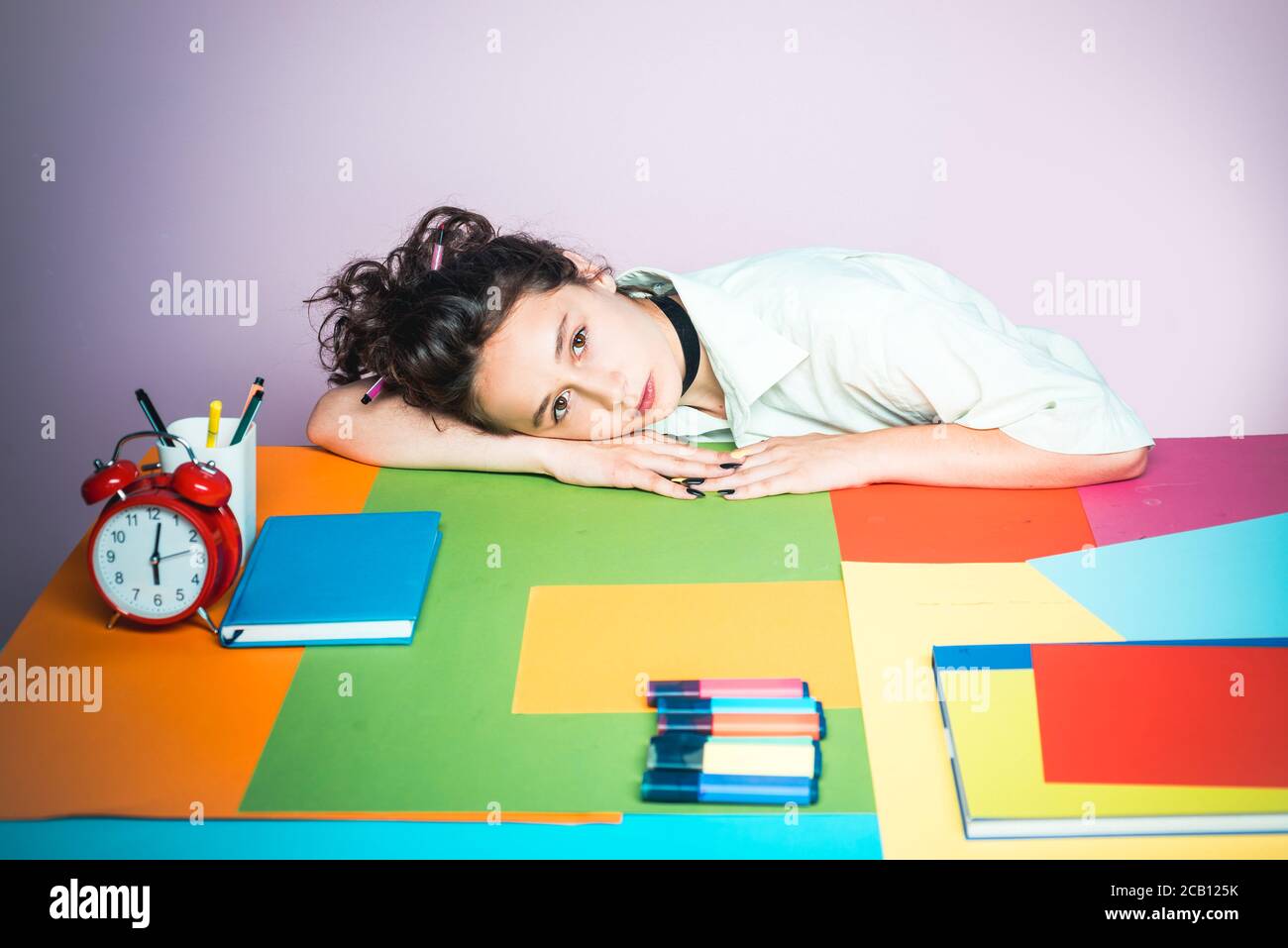 Sad or bored little student girl in classroom Stock Photo - Alamy