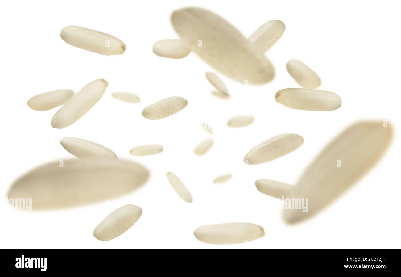Raw rice levitates on a white background Stock Photo - Alamy