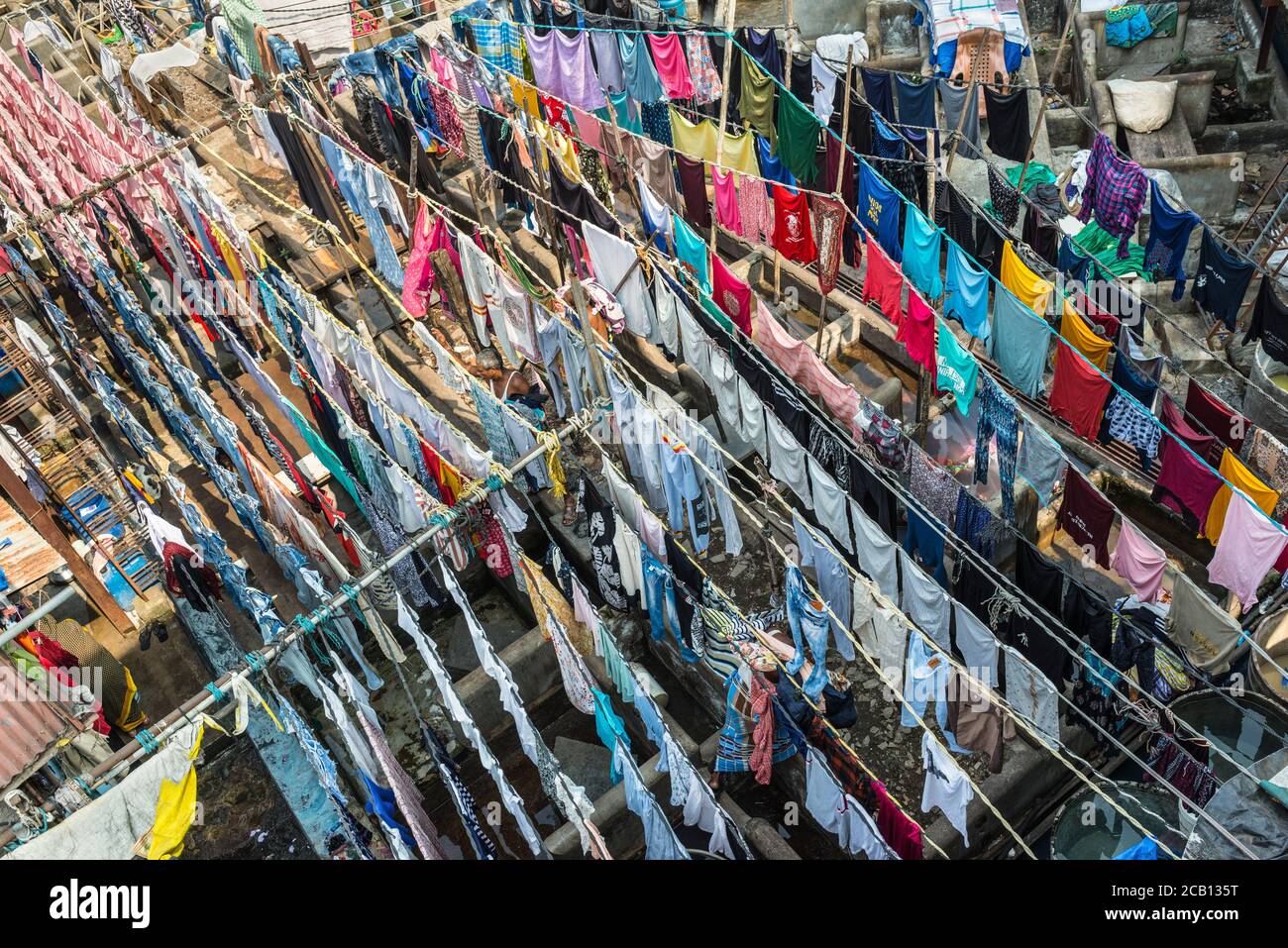 Mumbai, India - November 22, 2019: Colourful shirts and clothes hanging to dry at Dhobi Ghats central laundry.  It was constructed in 1890. Stock Photo