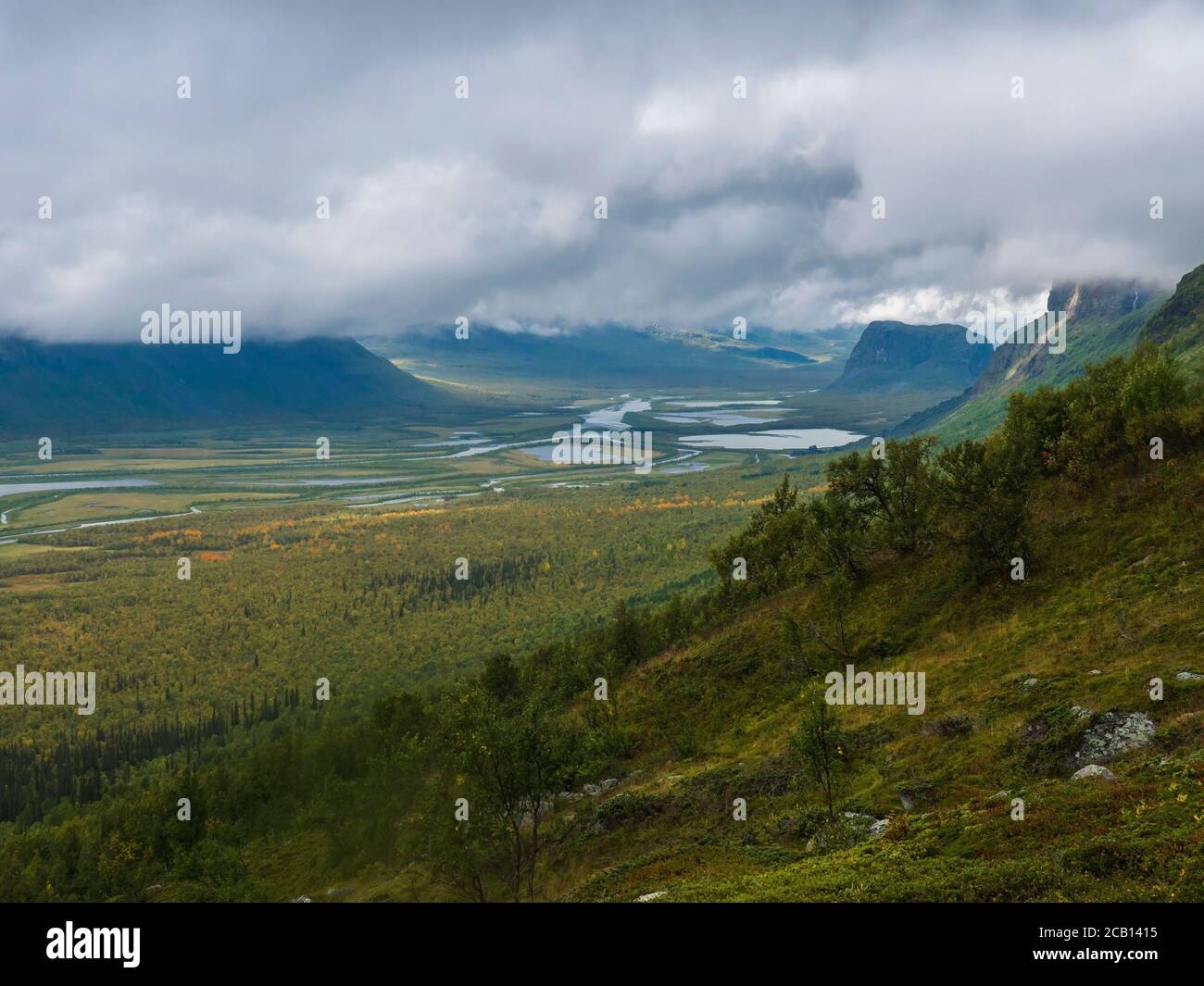 View on meandering river delta at Rapadalen valley in Sarek national park,  Sweden. Lapland mountains, rocks and birch trees. Early autumn colors Stock  Photo - Alamy