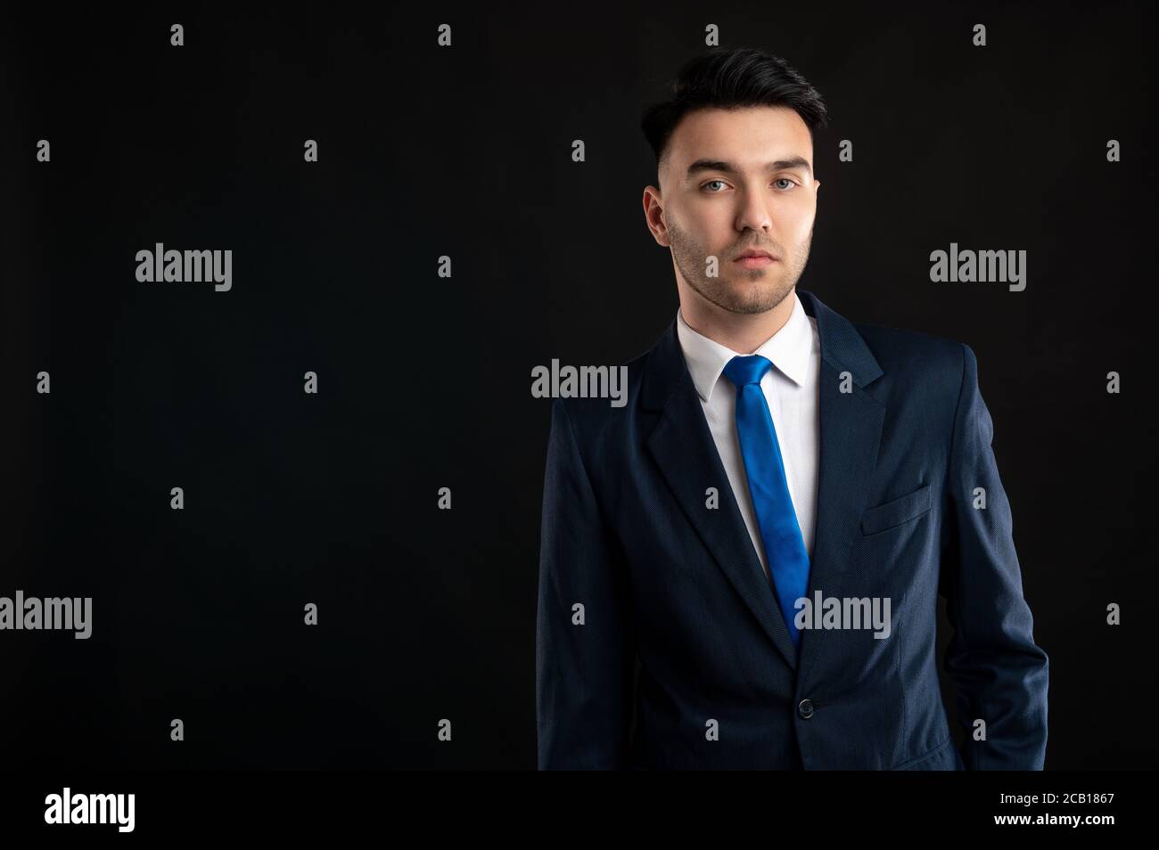 Portrait of business man wearing blue business suit and tie isolated on ...
