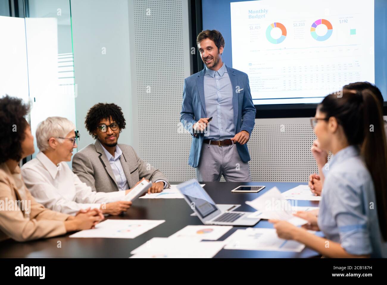Portrait of successful business team working in office Stock Photo - Alamy