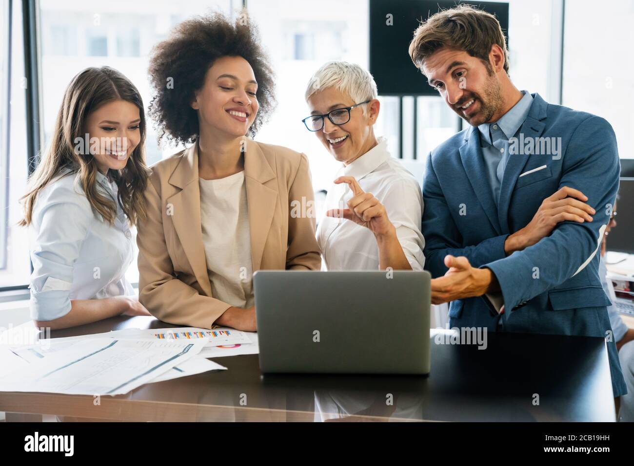 Portrait of successful business team working in office Stock Photo - Alamy
