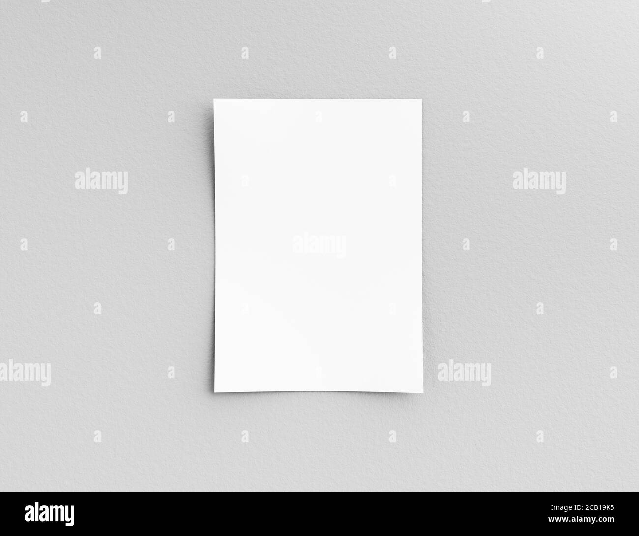 Hanging paper or pasteboard on a white wall for Information, display or