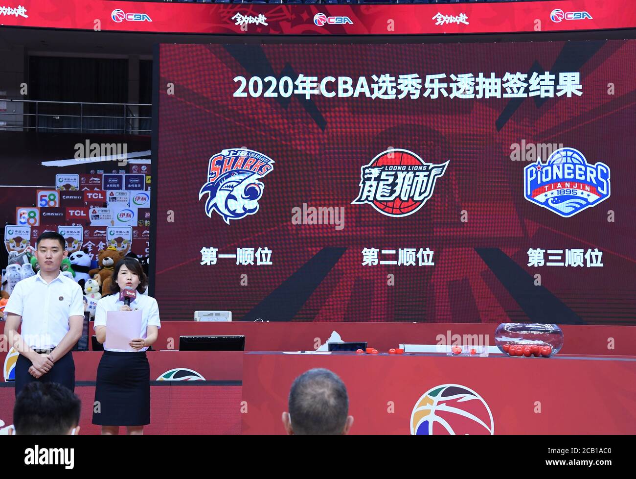 Qingdao. 10th Aug, 2020. Notaries announce the drawing result of the 2020 CBA draft lottery ceremony in Qingdao of east China's Shandong Province on Aug. 10, 2020. Shanghai Sharks won the first pick, Guangzhou Loong Lions and Tianjin Pioneers got the second and third pick respectively. Credit: Zhu Zheng/Xinhua/Alamy Live News Stock Photo