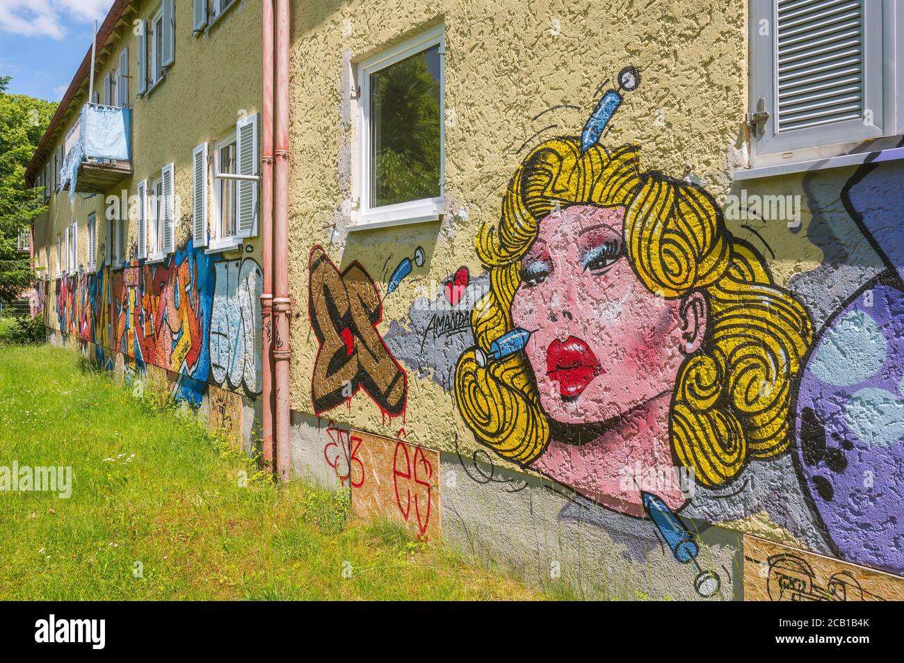 Satirical graffito, beauty surgery, demolition houses on Haldenseestrasse, Ramersdorf, Munich, Upper Bavaria, Bavaria, Germany Stock Photo