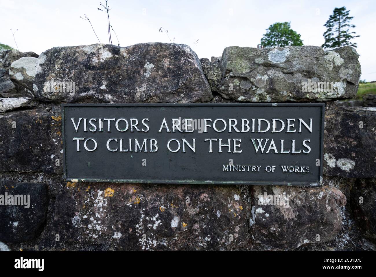 Warning sign in the ruins of Shap Abbey, Shap, Cumbria Stock Photo