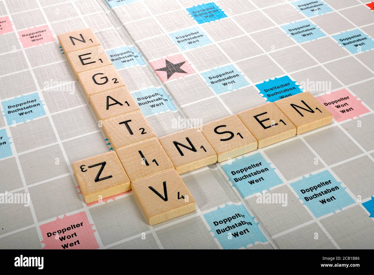 Letter game, symbolic image, letters form the words NEGATIVE INTEREST, Germany Stock Photo