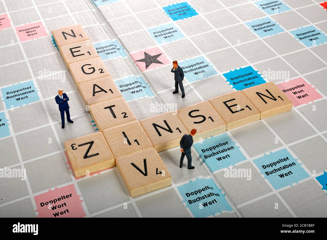 Letter game, symbolic image, letters form the words NEGATIVE INTEREST, Germany Stock Photo