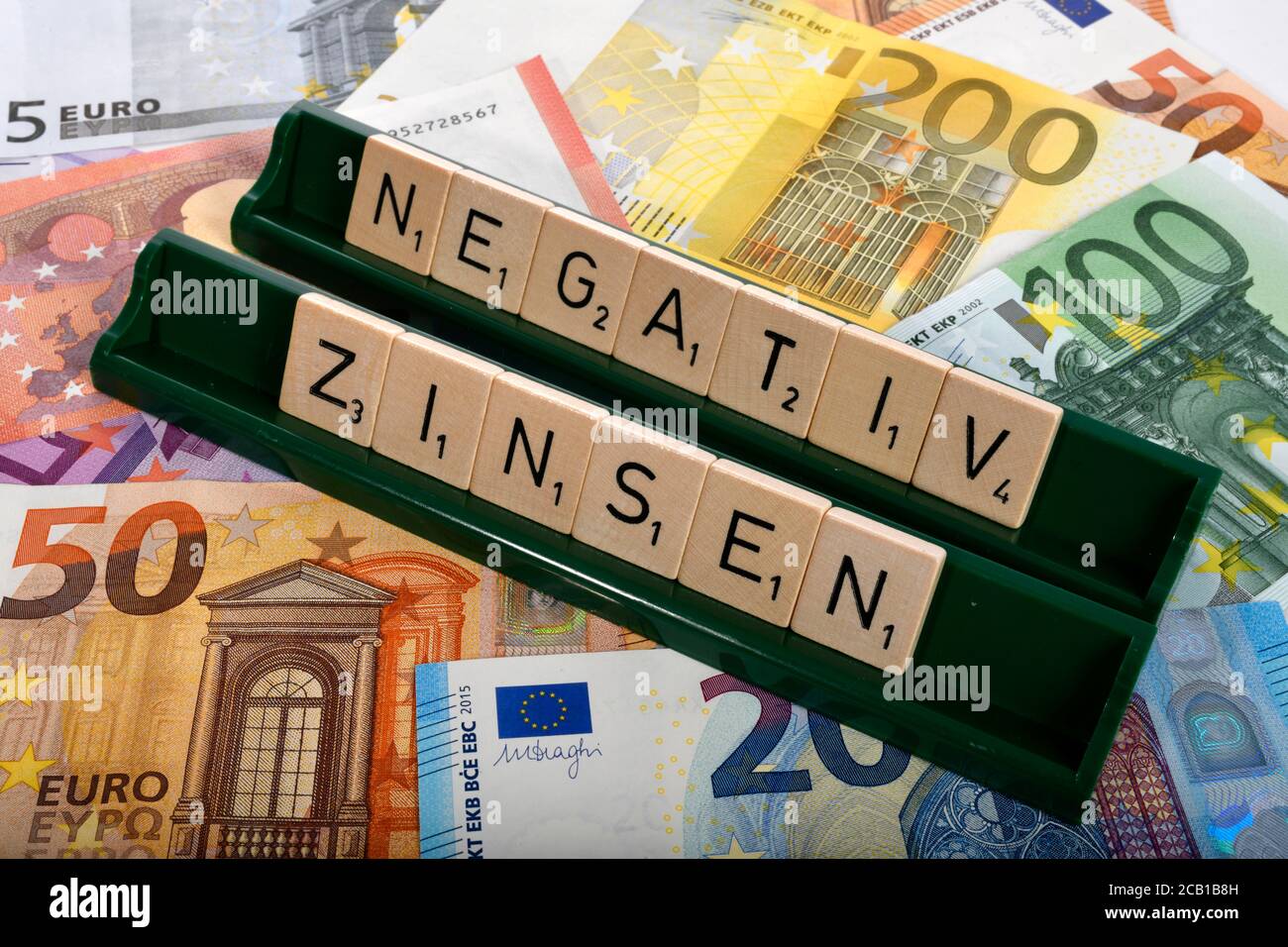 Letter game, symbolic image, letters form the words NEGATIVE INTEREST, Germany Stock Photo