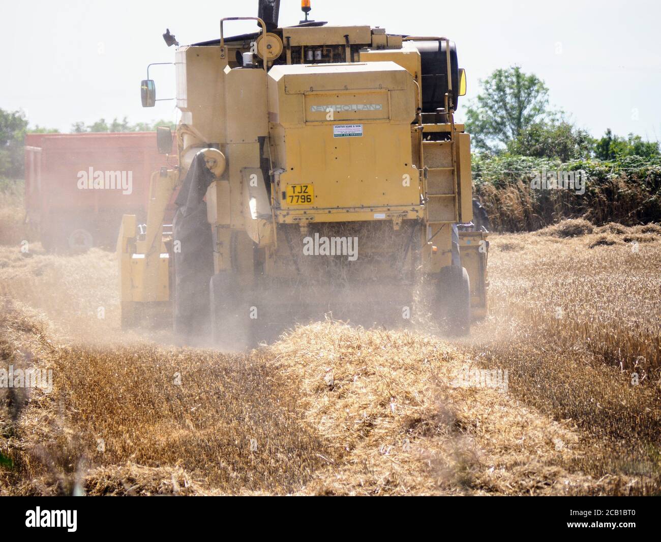 Harvest time...A combine harvester at work Stock Photo