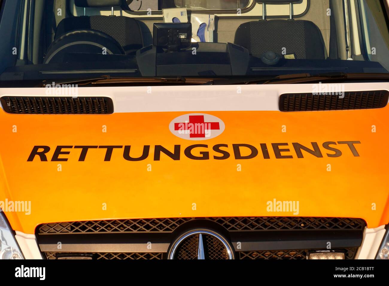 Lettering rescue service and Red Cross logo on an ambulance, Germany Stock Photo