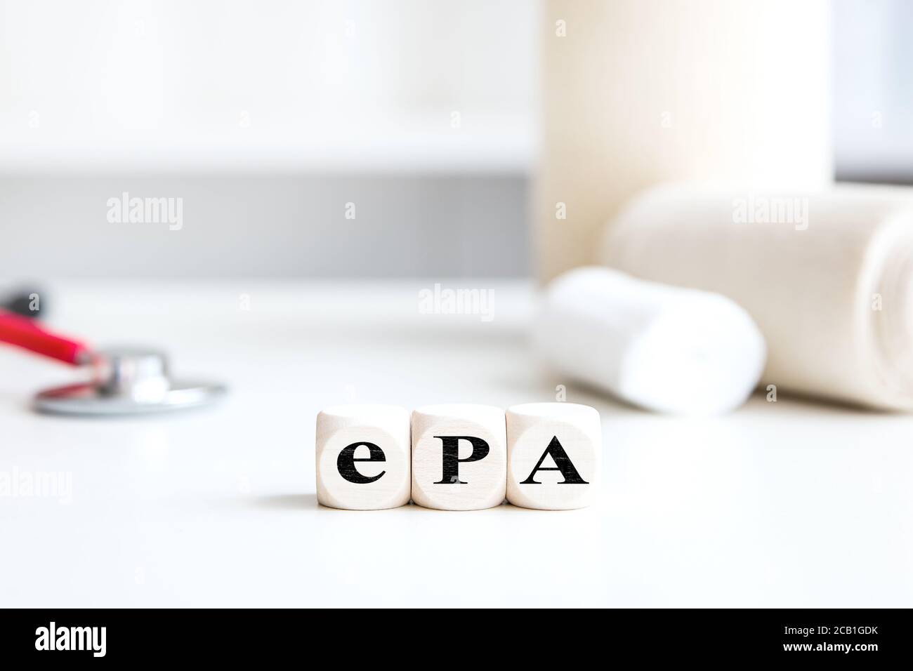 Medical office background with dice, word ePA, which means german