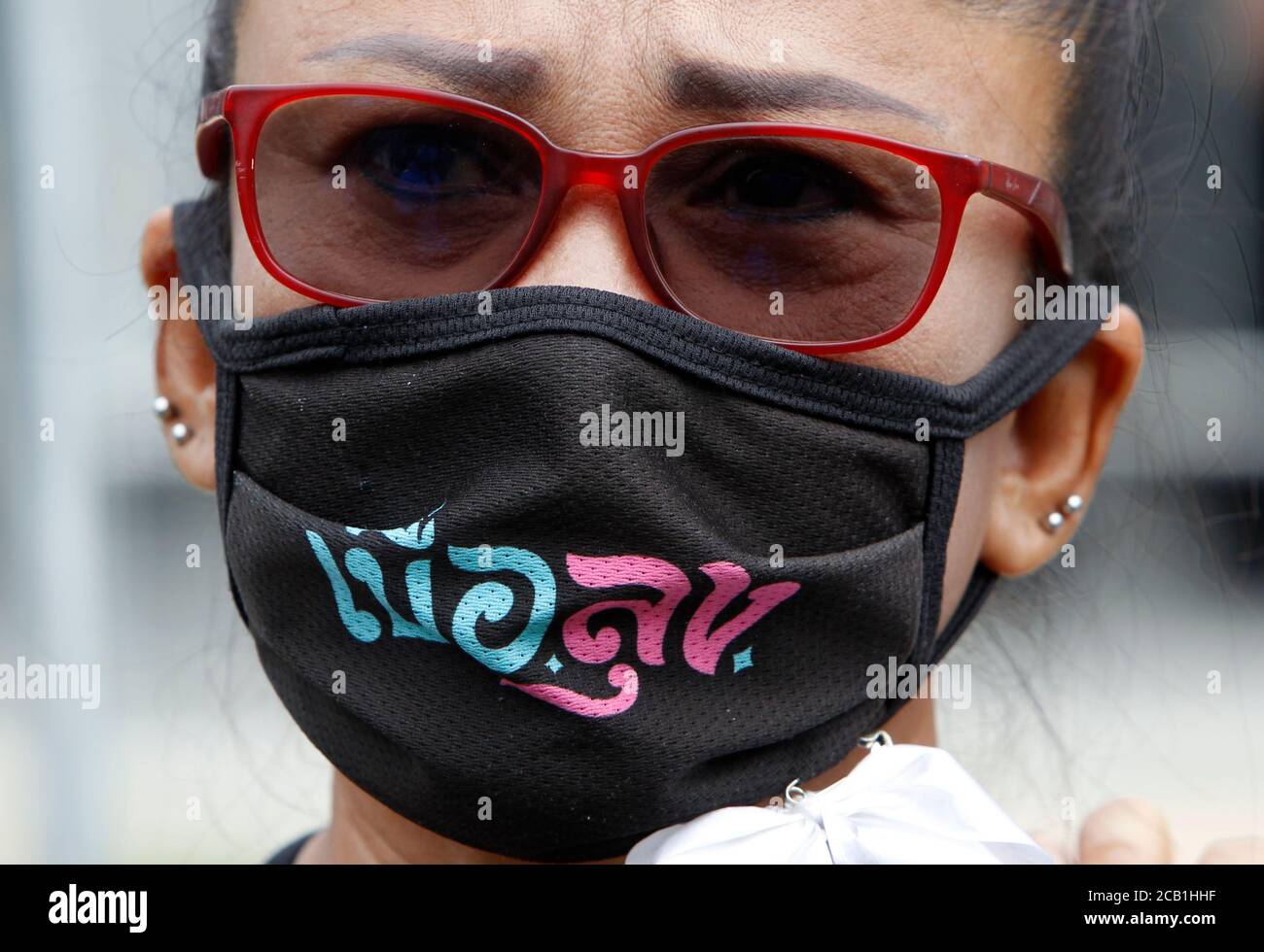 Bangkok, Thailand. 10th Aug, 2020. A protester looks on while wearing a face mask during the demonstration.protesters took to the streets demanding the resignation of the government and the dissolution of parliament. Organisers issued three demands: the dissolution of parliament, an end to harassment of government critics, and amendments to the military-written constitution that critics say virtually guaranteed victory for Prayuth's party in elections last year. Credit: SOPA Images Limited/Alamy Live News Stock Photo
