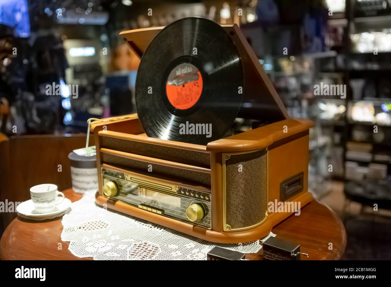 View of a vintage style wooden turntable on display in a store Stock
