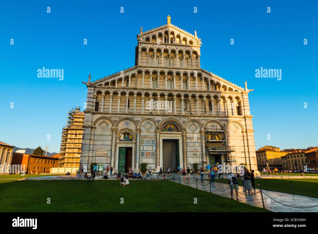 Nice front view of the medieval Pisa Cathedral façade. Above the doors are four rows of open galleries with, on top, statues of Madonna with Child and... Stock Photo
