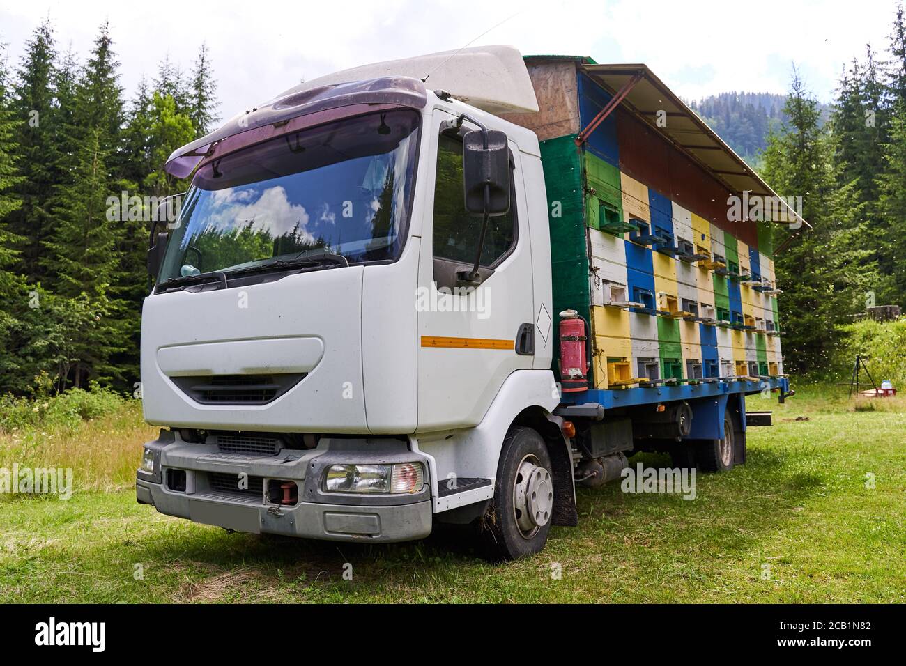 A lorry with bee hives in the mountains Stock Photo