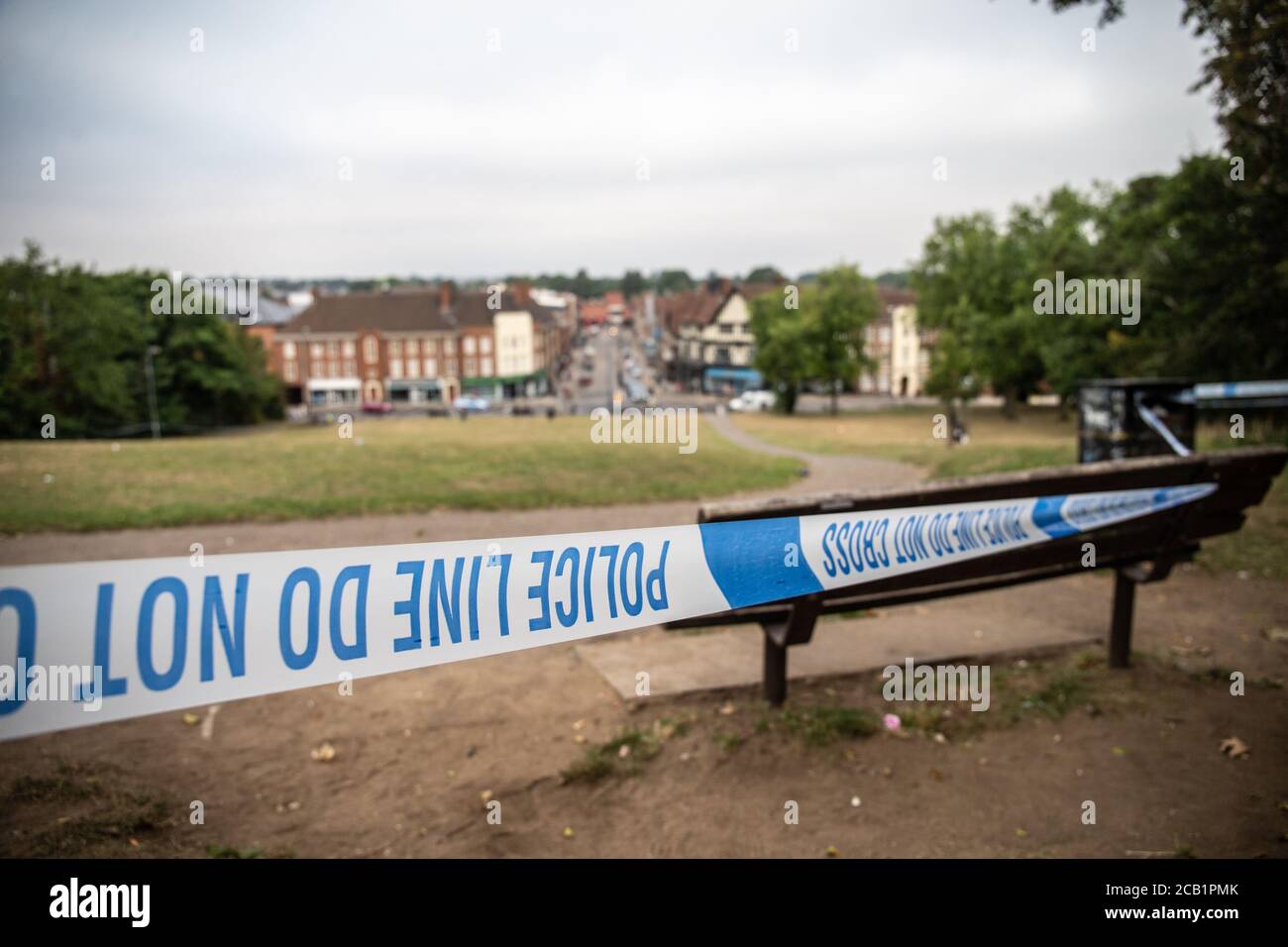 Police tape cordon at outdoor crime scene in UK Stock Photo