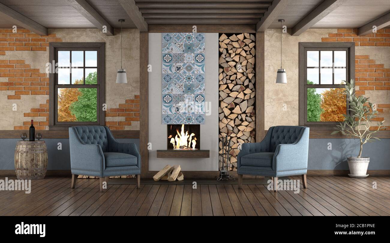 Rustic style room with old fireplace and two classic armchairs - 3d rendering Stock Photo