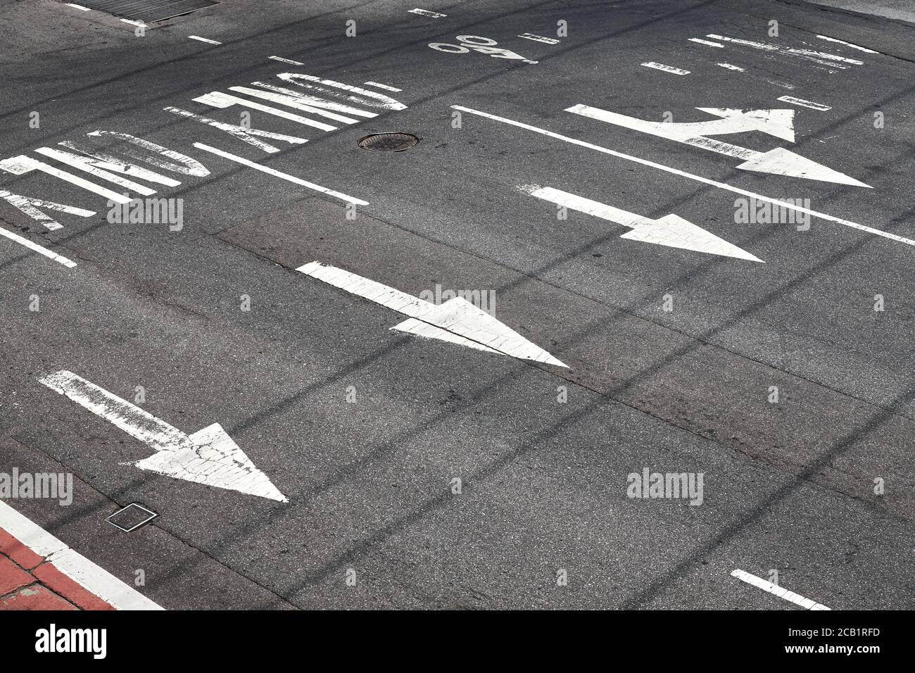 Road surface arrow markings on asphalt in New York City, USA. Stock Photo