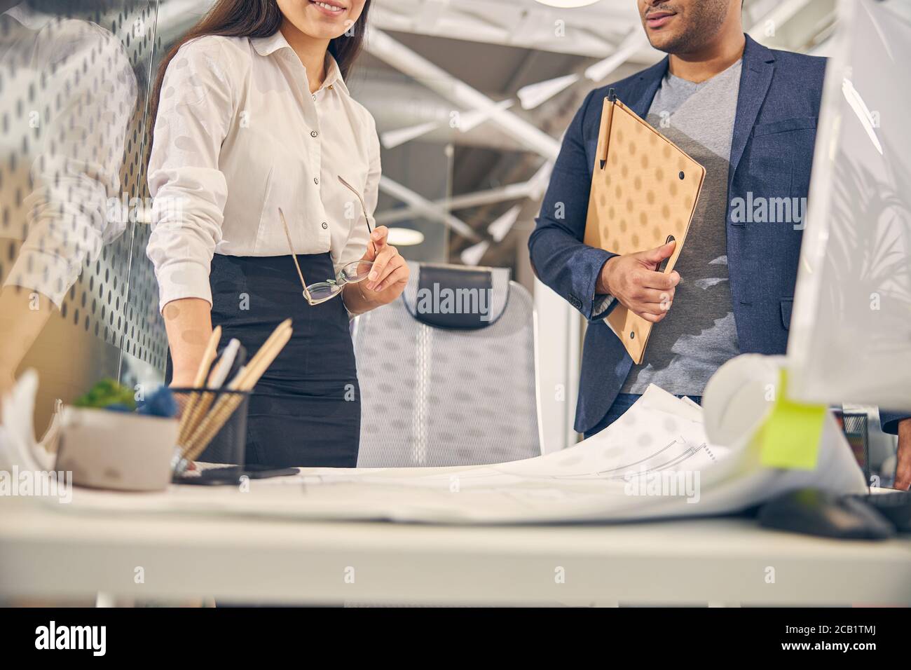 Two office workers discussing their new project Stock Photo