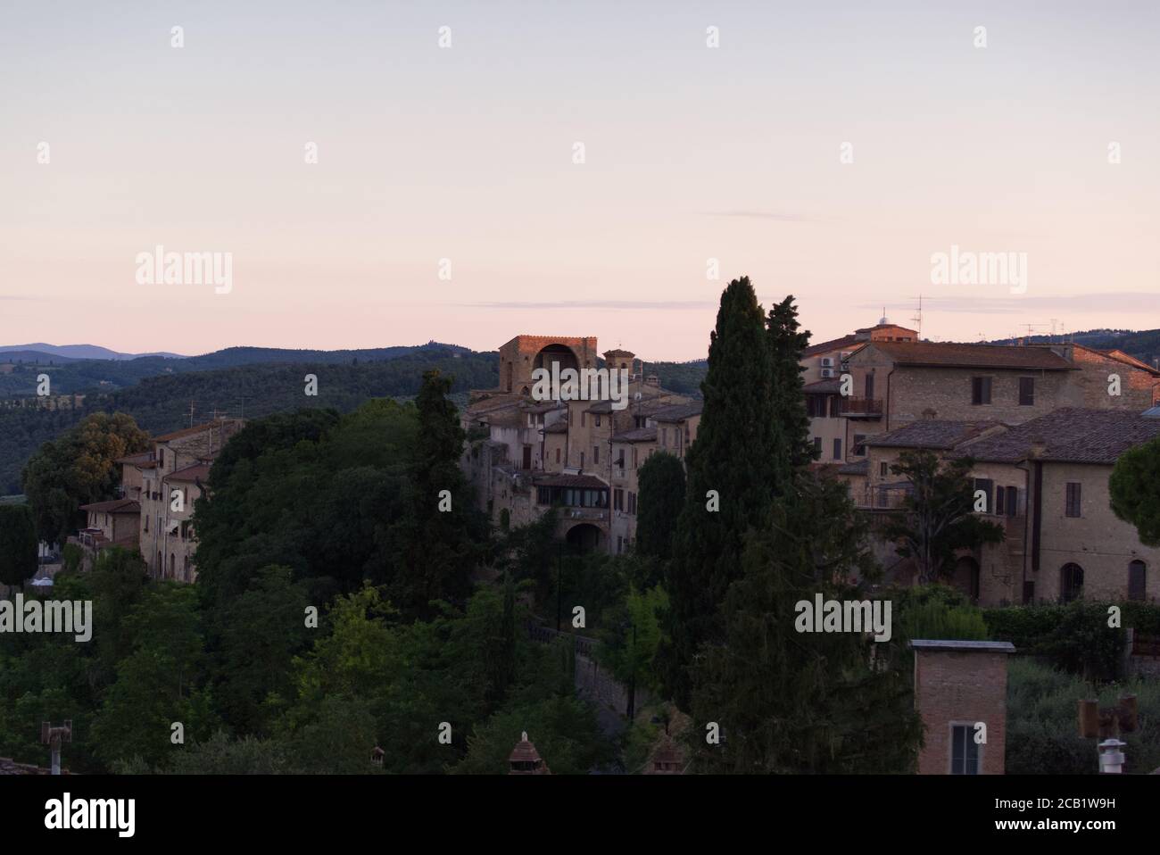 Evening lights on the Tuscan landscape, view from the town of San Gimignano Stock Photo