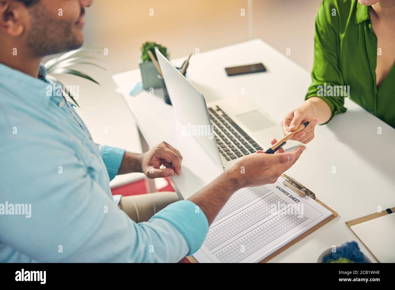 Focused photo on man that stretching hand Stock Photo