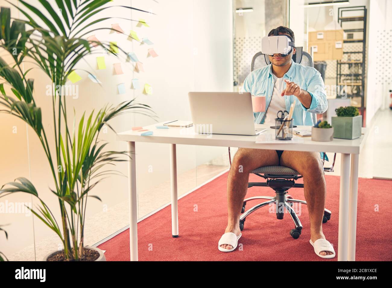 Well Rested Person At Work Positive delighted male person having rest at work Stock Photo - Alamy