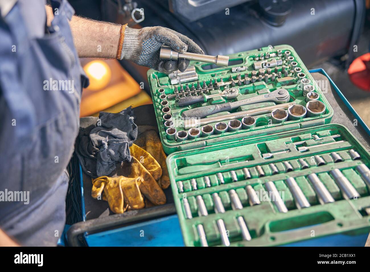 Focused photo on male hand taking spanner Stock Photo