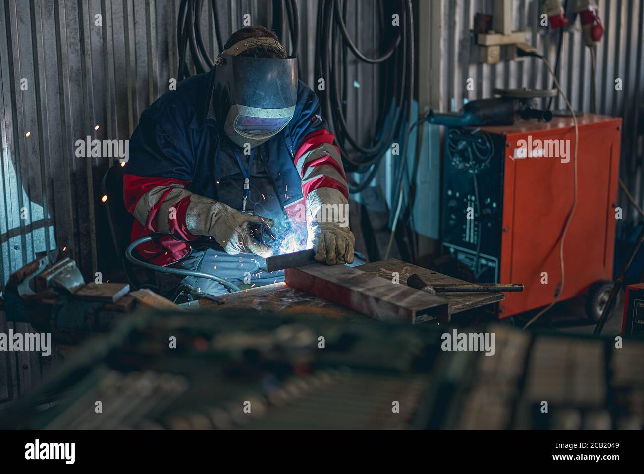 Concentrated welder using mask while doing serious work Stock Photo