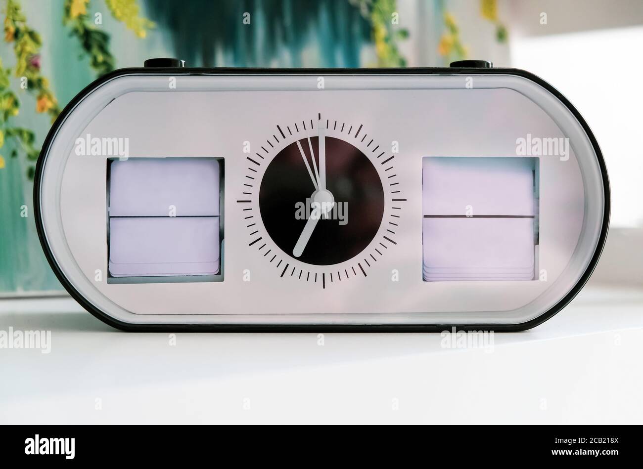 Close-up clock showing date and day of the week, frame, mock up Stock Photo