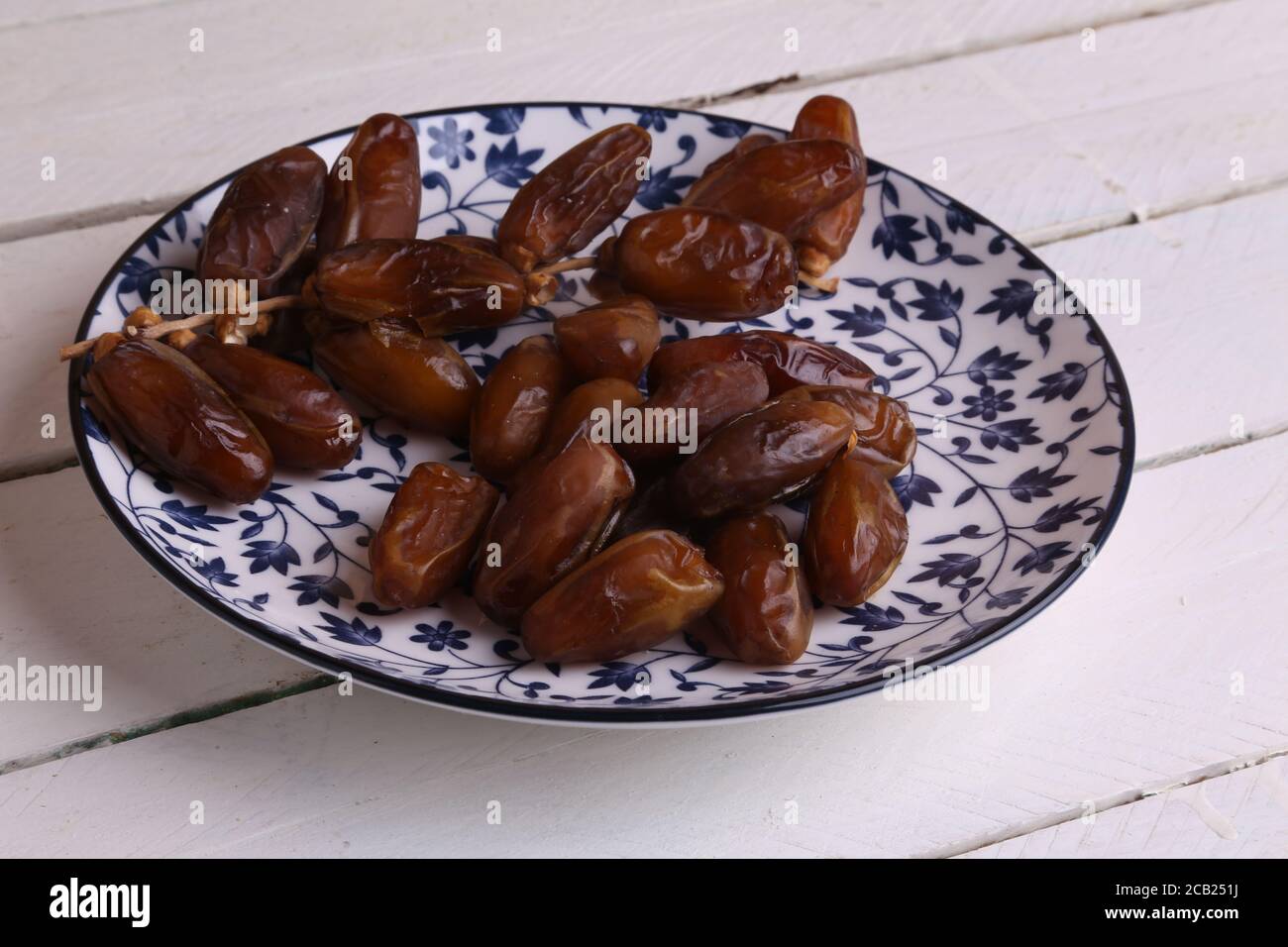 Delicious and sweet dried date palm fruits on the plate Stock Photo Alamy