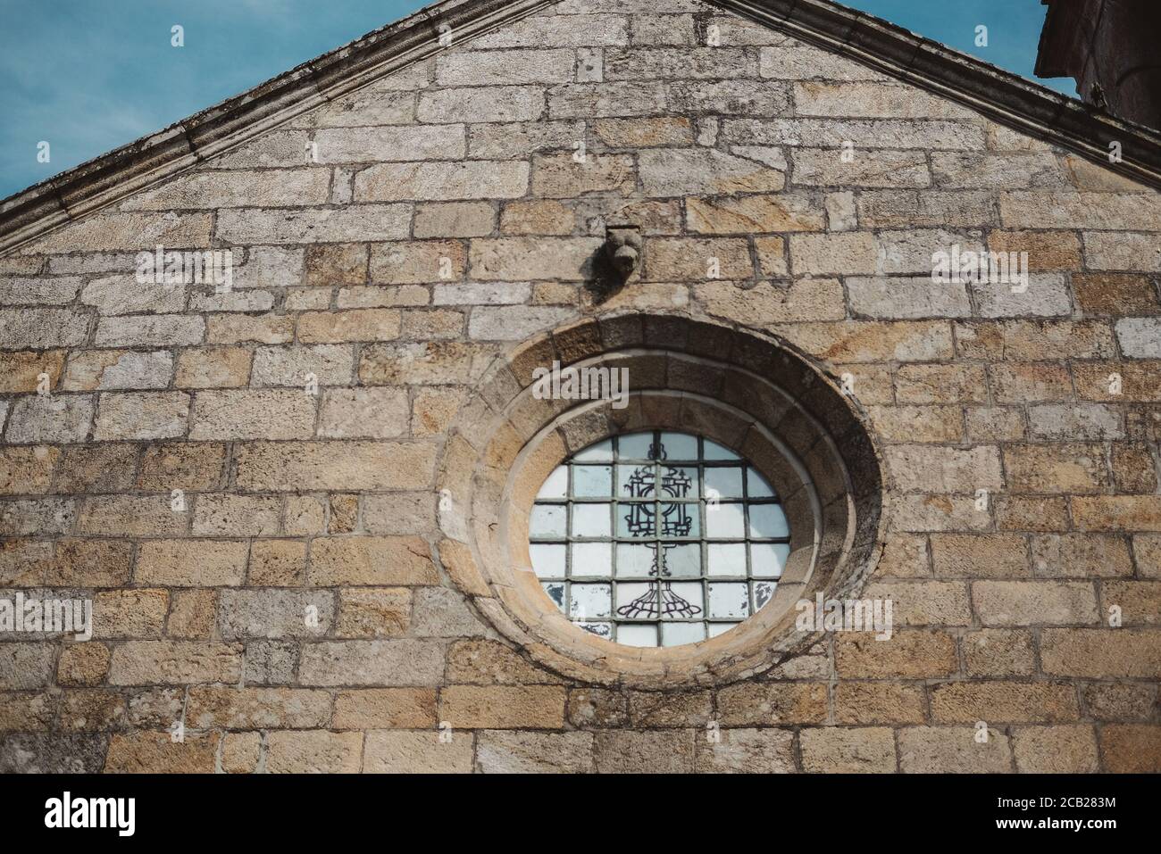 Closeup shot of a circle-shaped window on an ancient building in ...