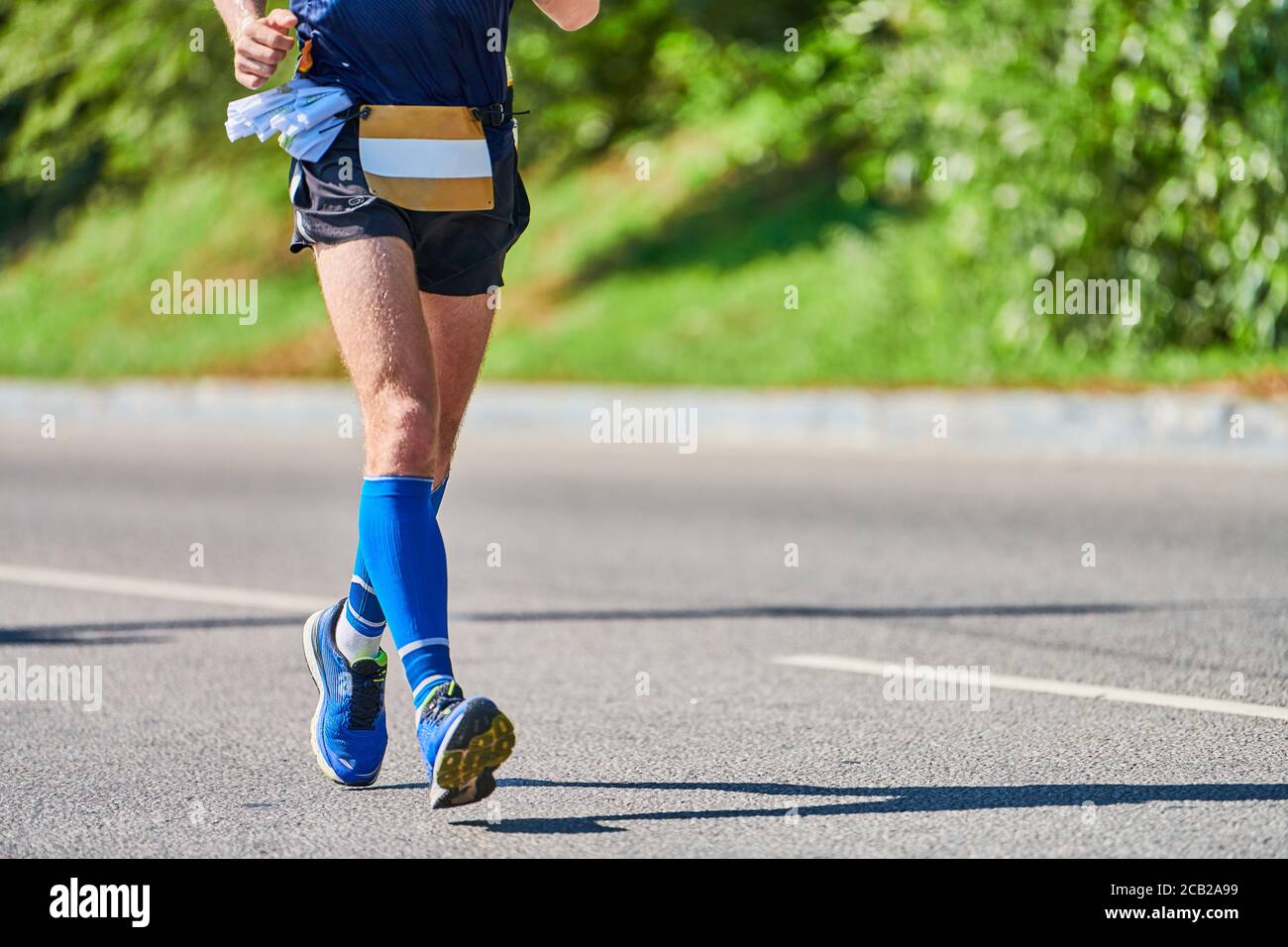 Running man. Athletic man jogging in sportswear on city road. Healthy  lifestyle, fitness sport hobby. Street workout, sprinting outdoor Stock  Photo - Alamy