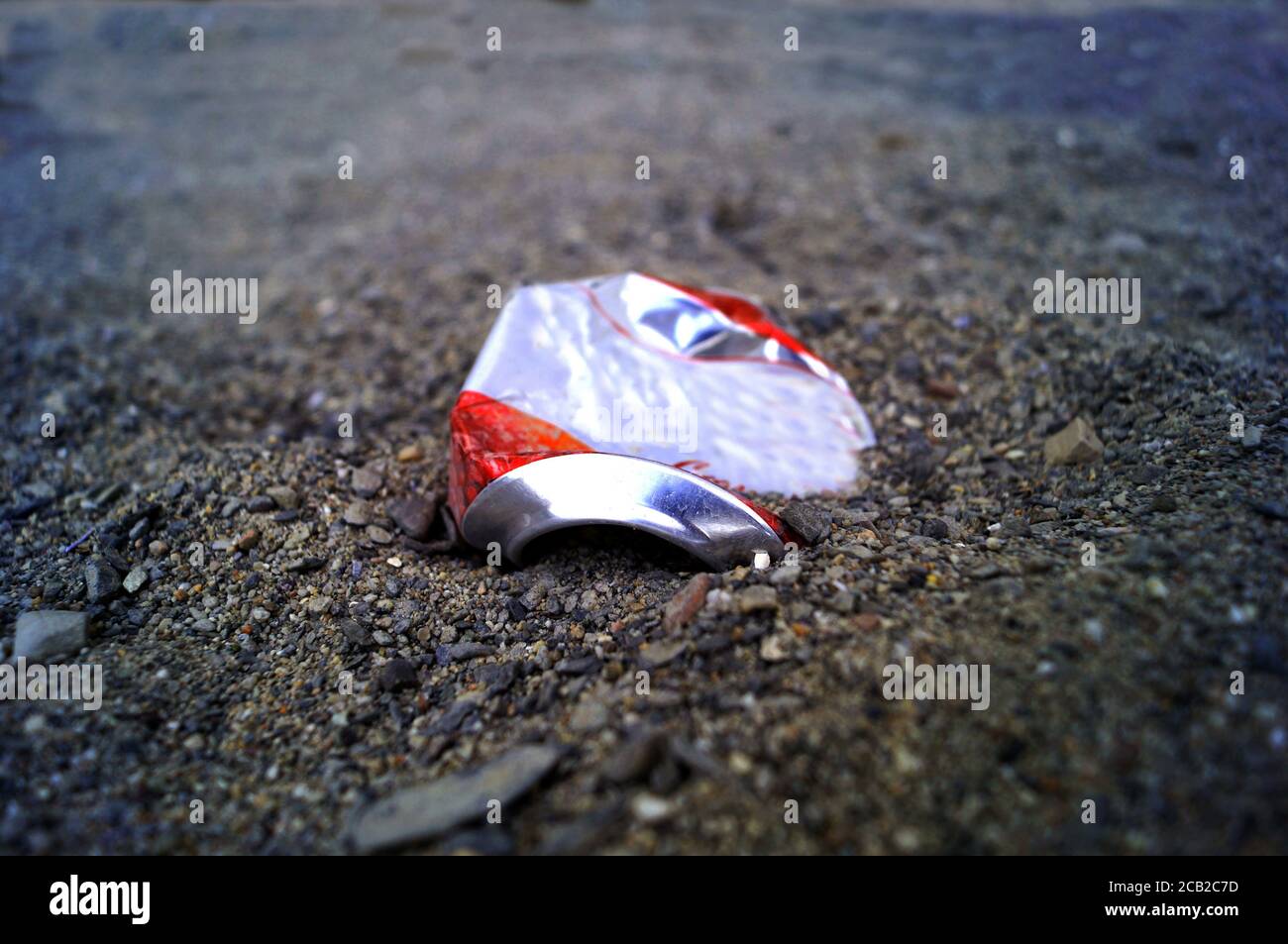 Crushed can on the beach Stock Photo