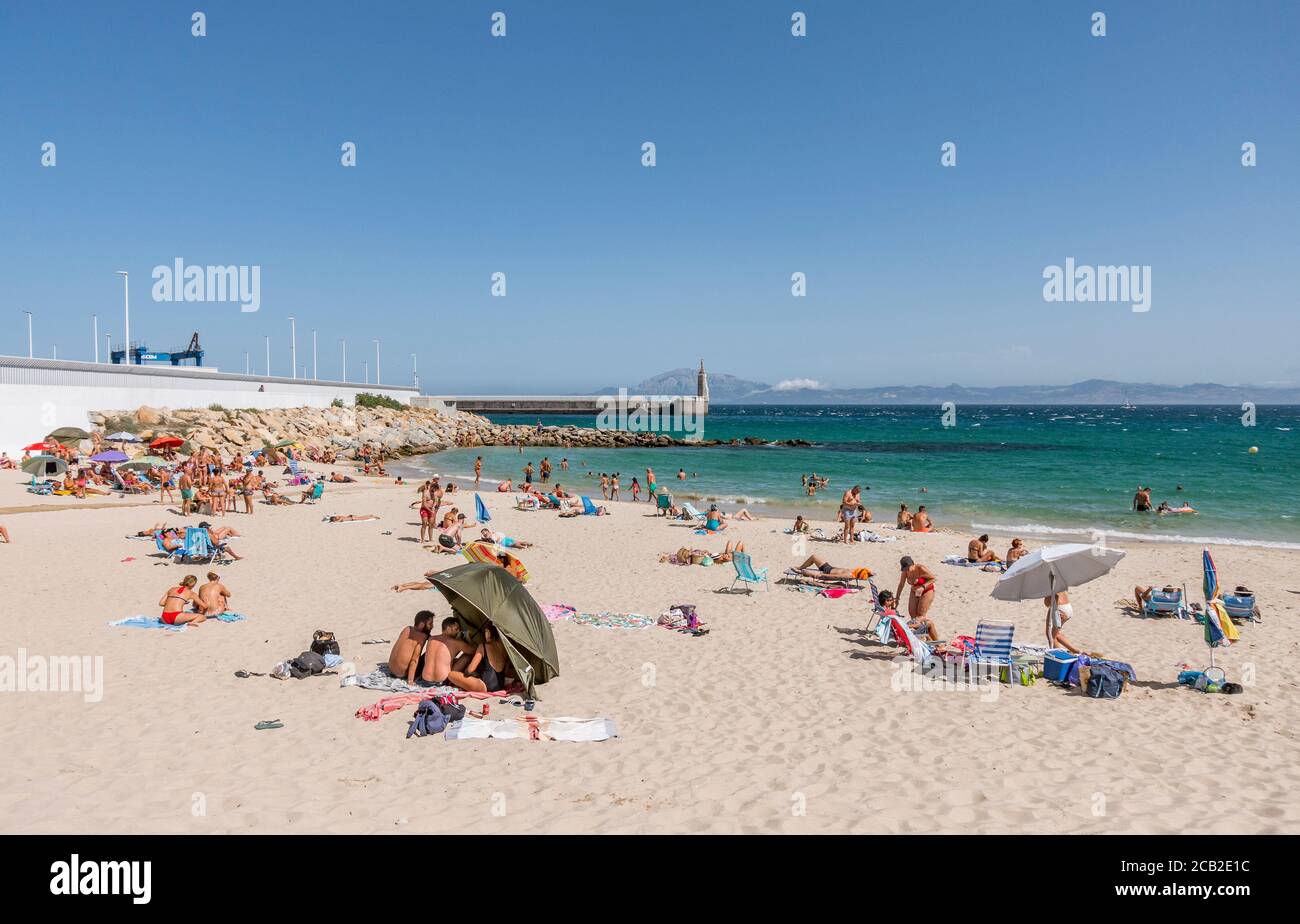 Tarifa Beach, High season with sunbathers at Atlantic ocean, Playa chica, during Covid 19 crisis, Tarifa,, Andalusia, Spain Stock Photo