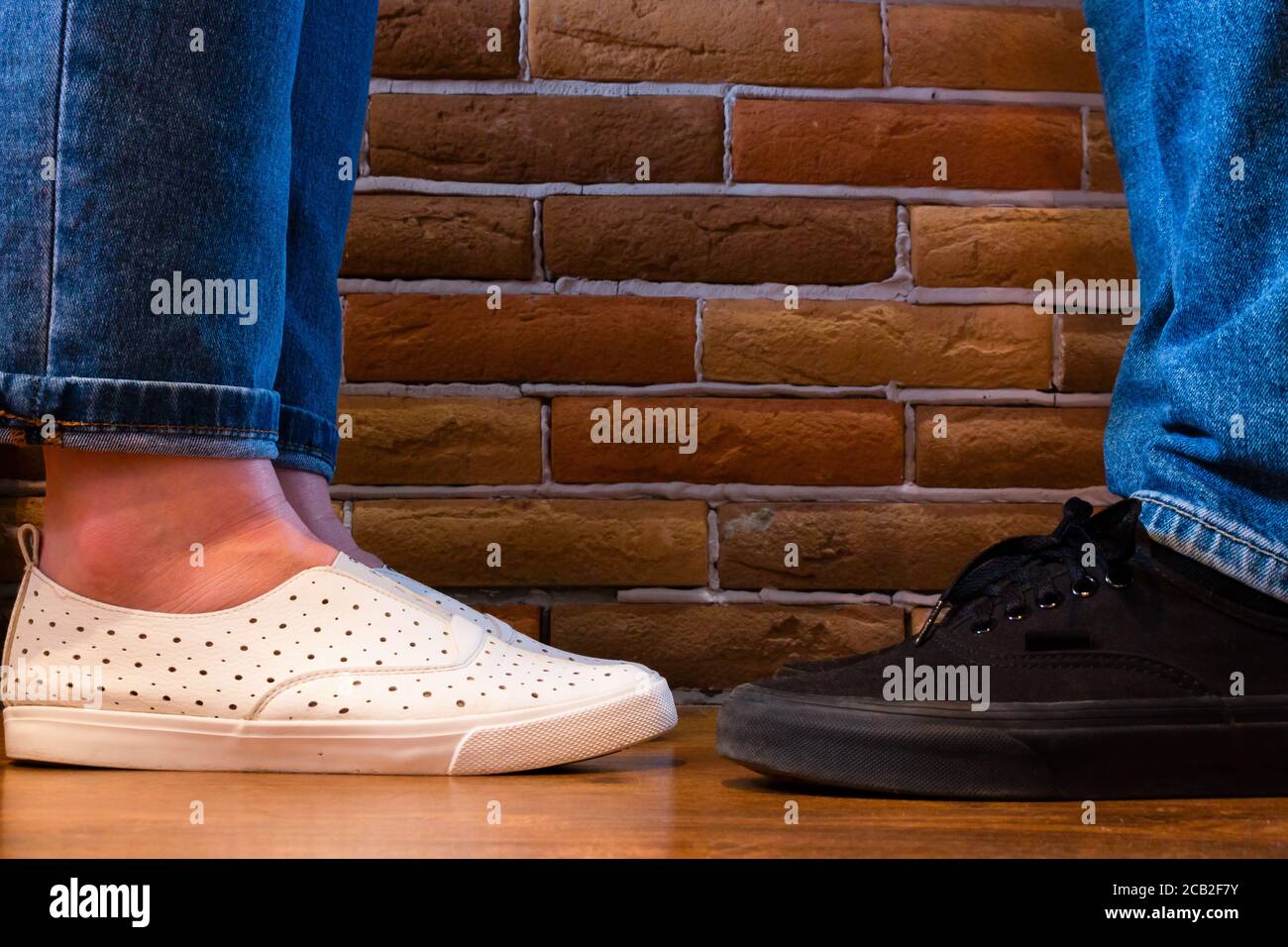 sneakers close-up. man and girl are facing each other Stock Photo - Alamy