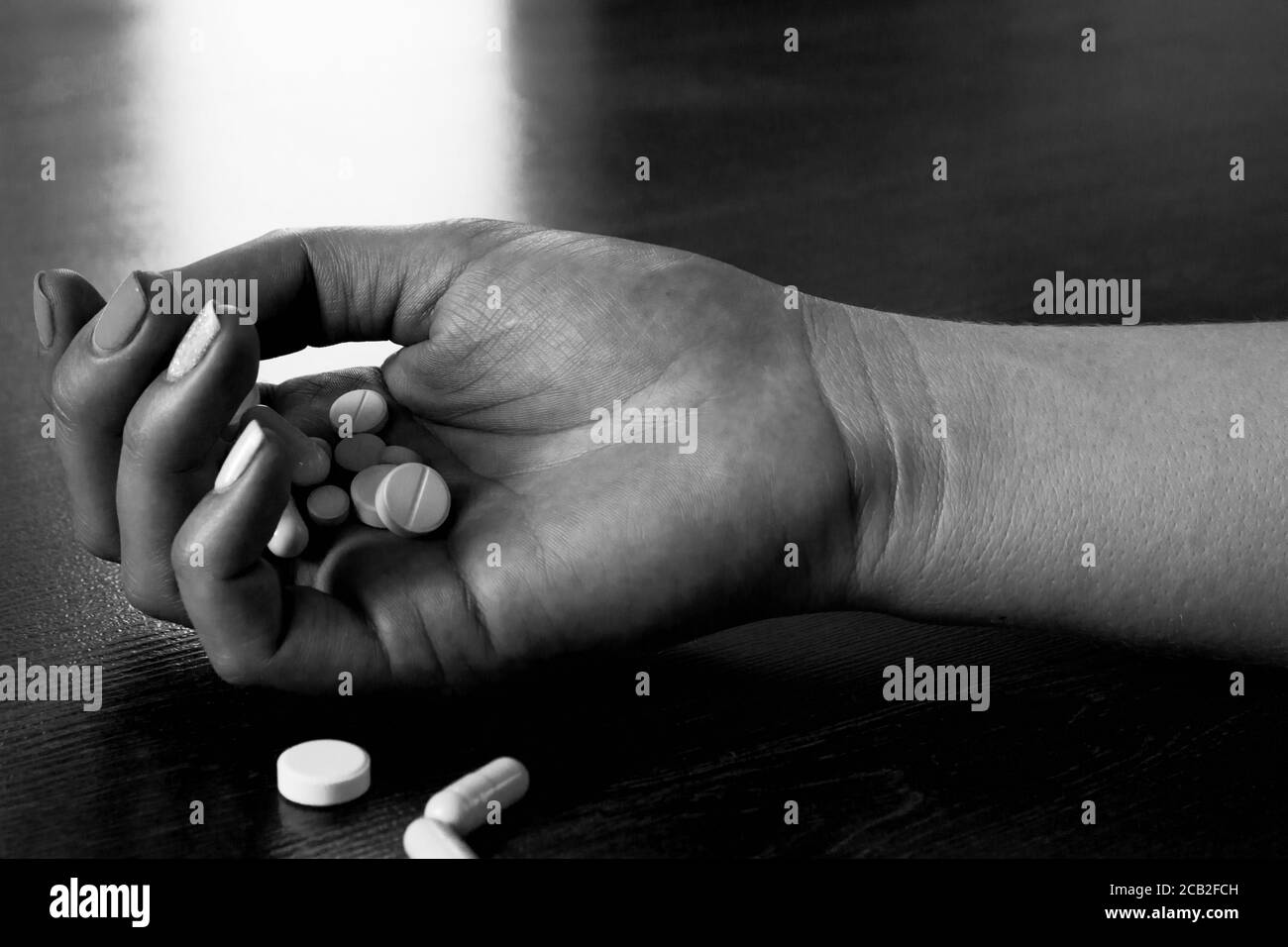 hand and pills close-up. concept suicide Stock Photo