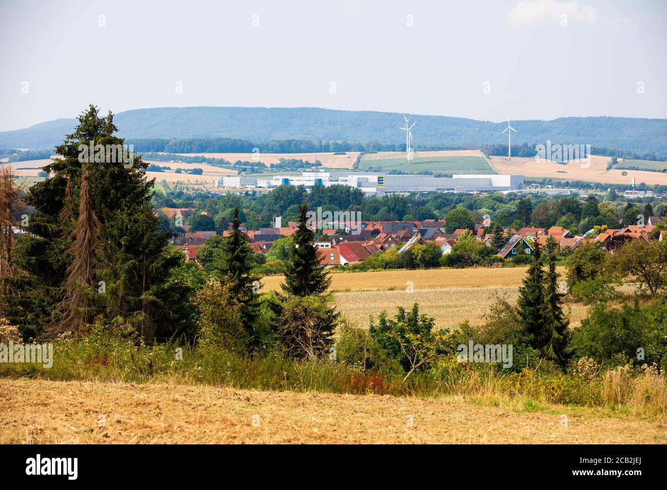 10 August 2020, Lower Saxony, Lauenau: A part of the village of Lauenau can be seen between fields in summer weather. After the collapse of the water supply in Lauenau in the district of Schaumburg, the municipality has got the situation under control. Photo: Moritz Frankenberg/dpa Stock Photo