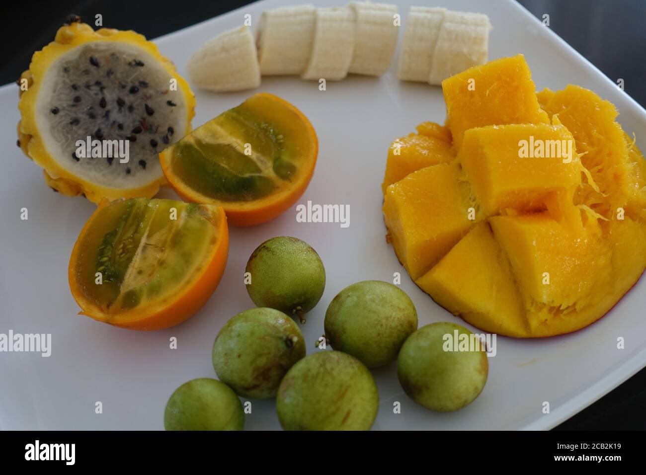 Collection of tropical fruits - Mango, Banana, Dragonfruit, Mammon, Lulo. Stock Photo