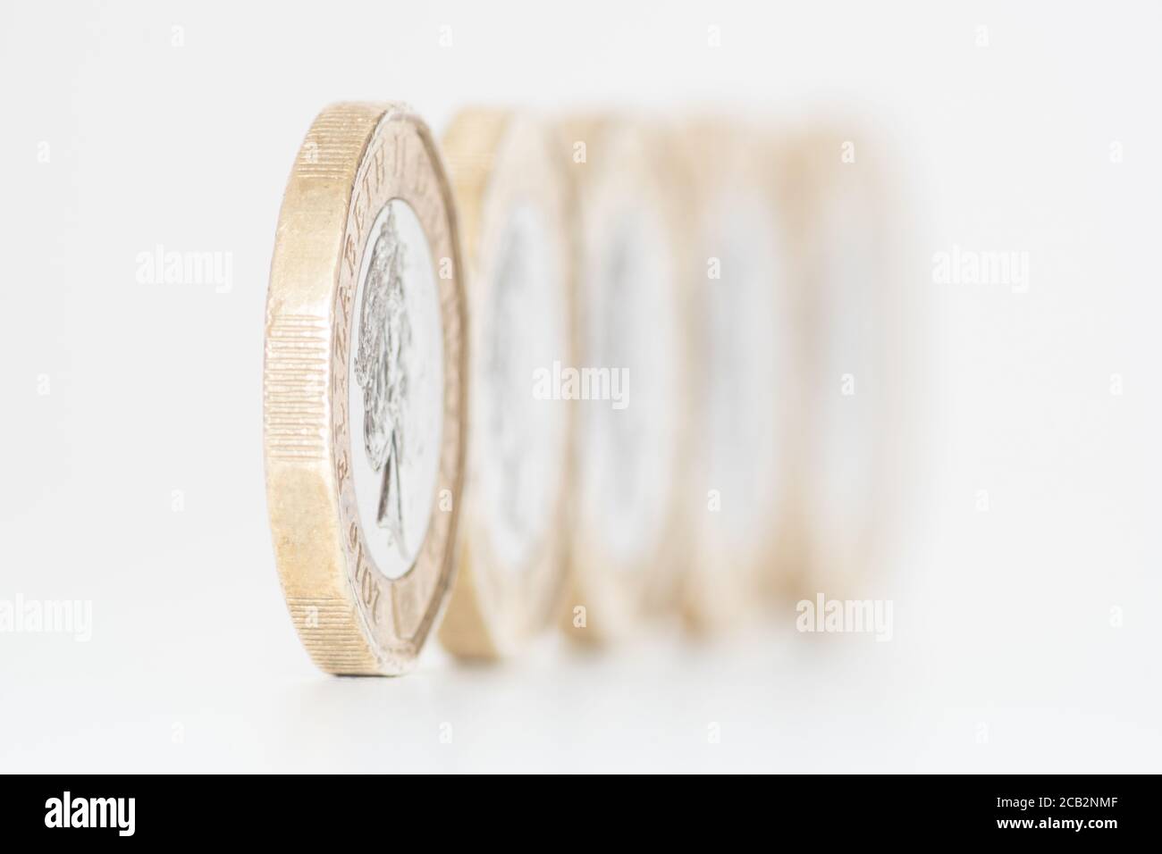 Coins lined up hi-res stock photography and images - Alamy