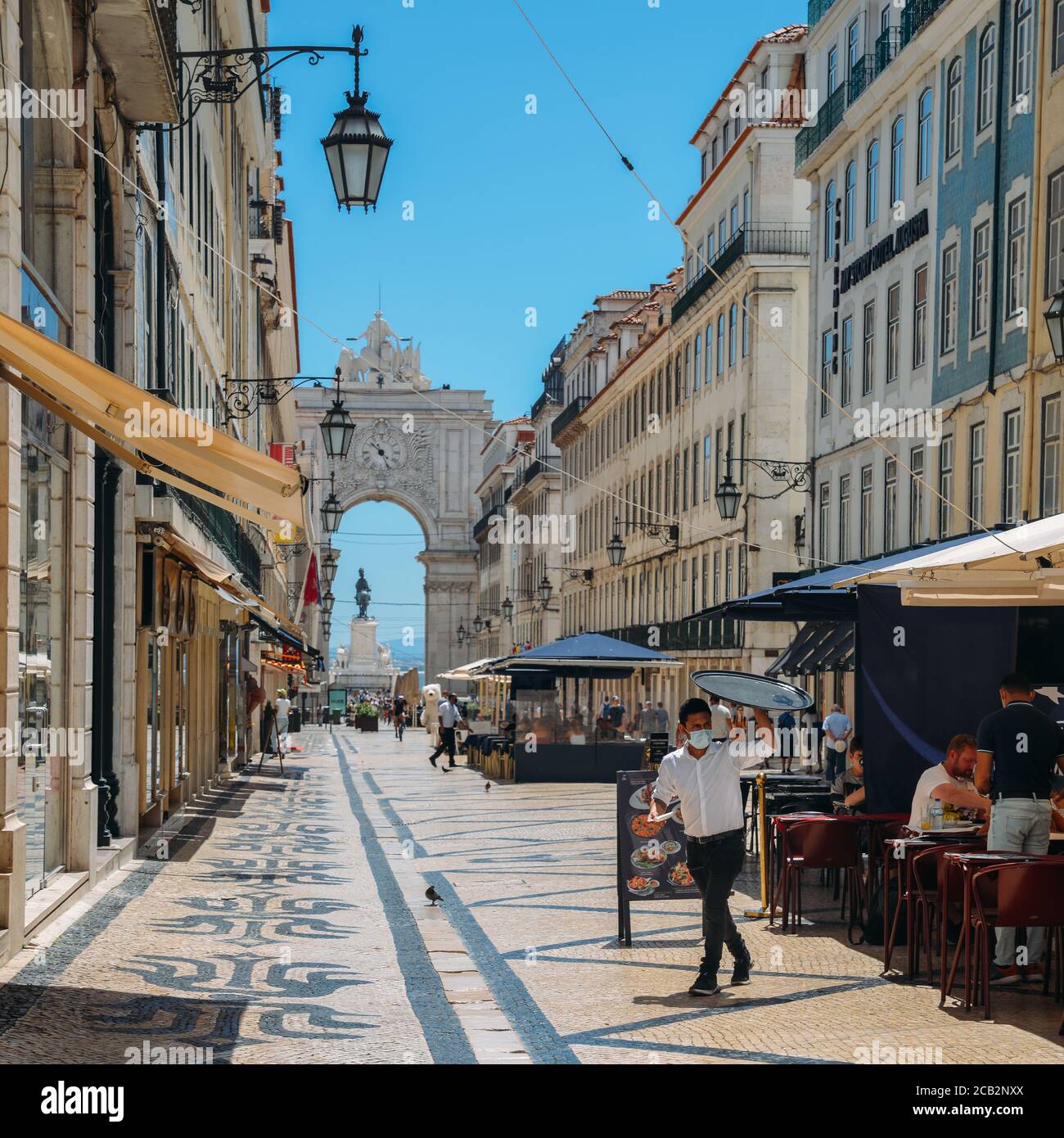 Almost deserted Augusta Street in Baixa, Lisbon, Portugal during the Coronavirus Covid-19 outbreak as many tourists decide to stay at home Stock Photo