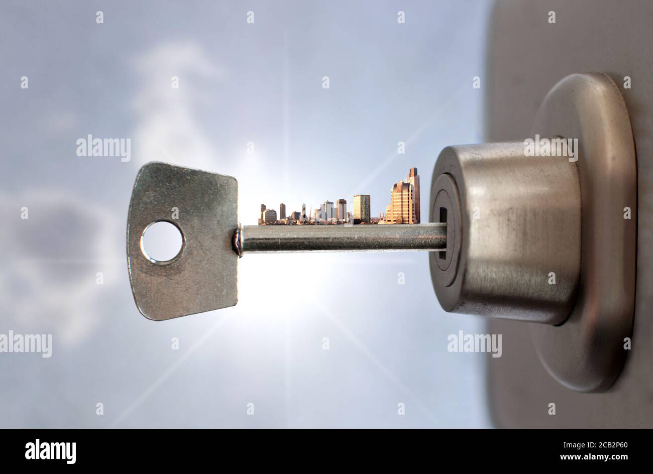 Key With City Skyline Inside A Door Lock Stock Photo Alamy