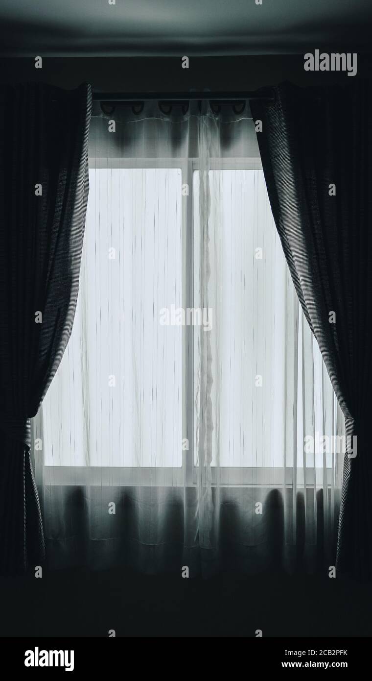 white see through sheer window curtain at home. transparent fabric