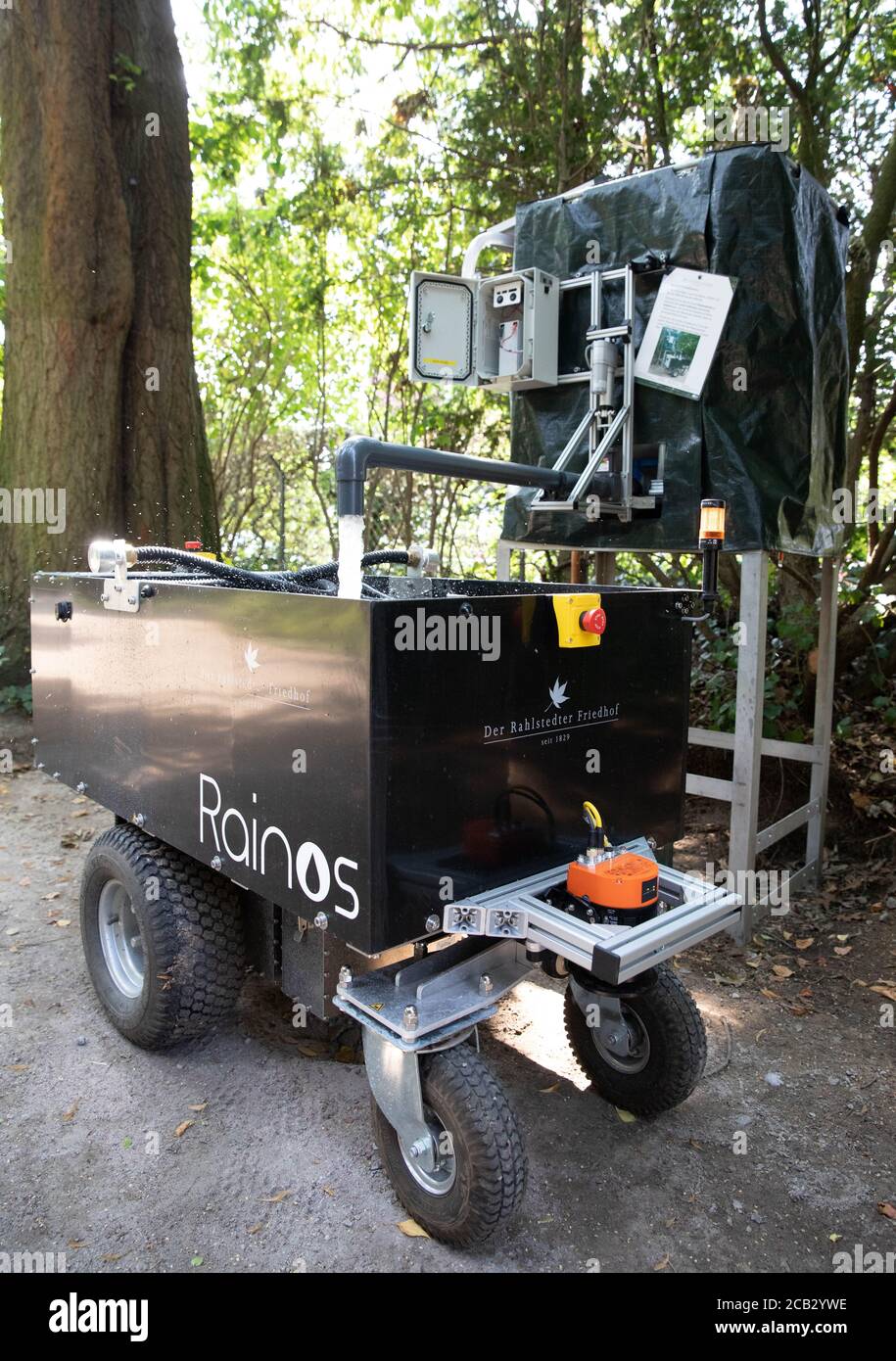 Hamburg, Germany. 10th Aug, 2020. During a photo shoot at the Rahlstedt cemetery, the 'Rainos' watering robot fills up water at an automatic tap. The autonomous vehicle with its 200-litre tank drives through the rows at the cemetery at night between 10 p.m. and 6 a.m. and pours a predetermined amount of water at previously programmed grave sites. Credit: Christian Charisius/dpa/Alamy Live News Stock Photo