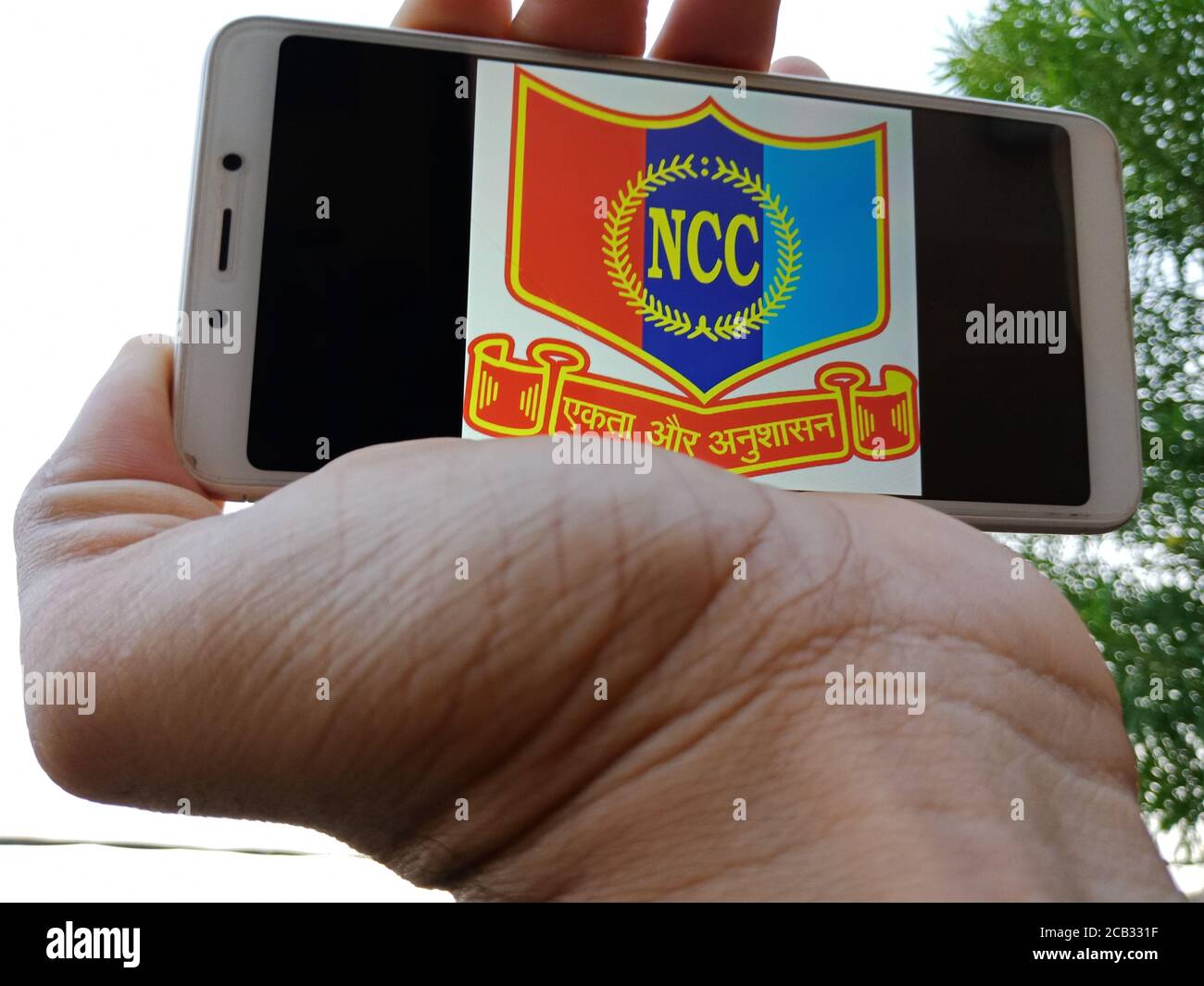 DISTRICT KATNI, INDIA - MAY 23, 2020: Man holding smart phone with  displayed National Cadet Corps NCC on screen. Indian government Training  organizati Stock Photo - Alamy