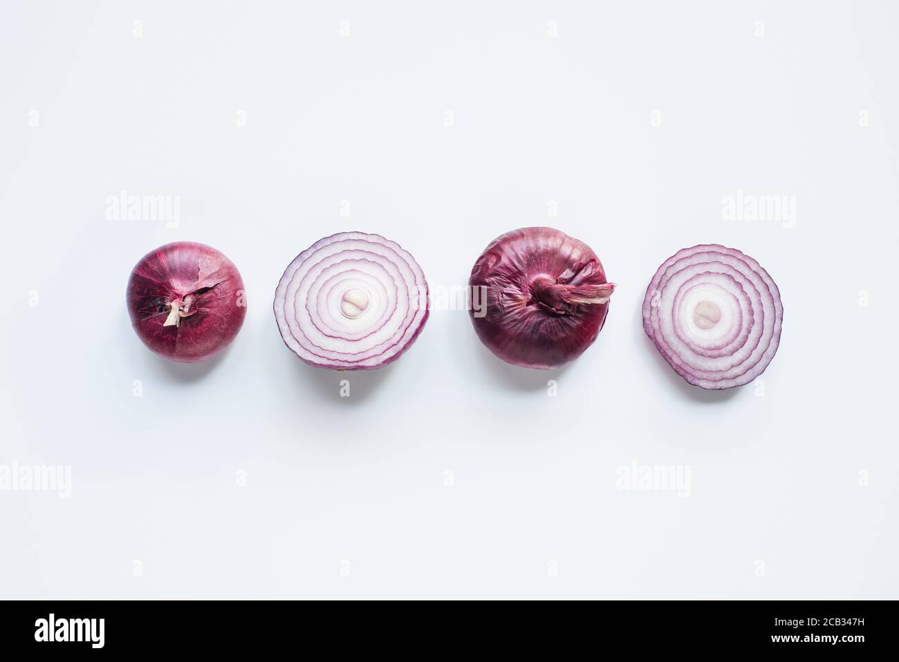 top view of cut and whole red onion on white background Stock Photo - Alamy