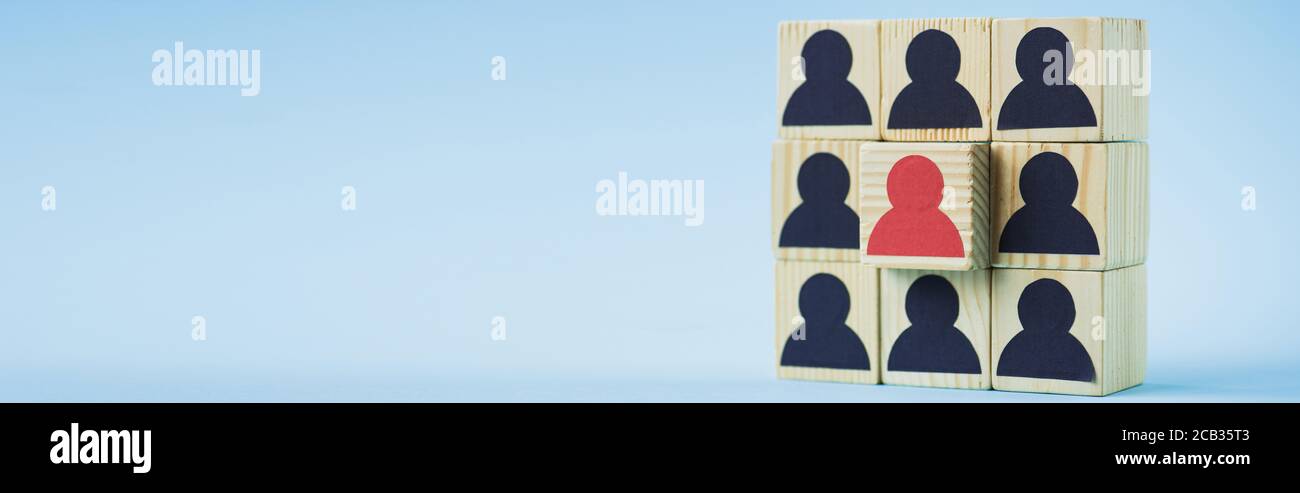 square of wooden blocks with black and red human icons on blue ...