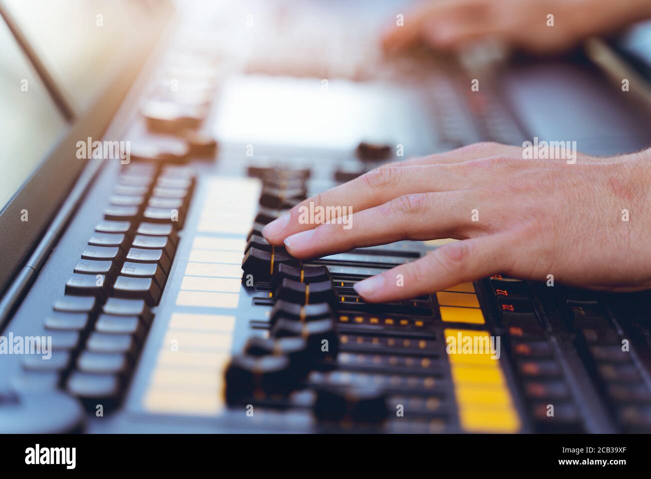 Sound technician or lights technicians control the music show in