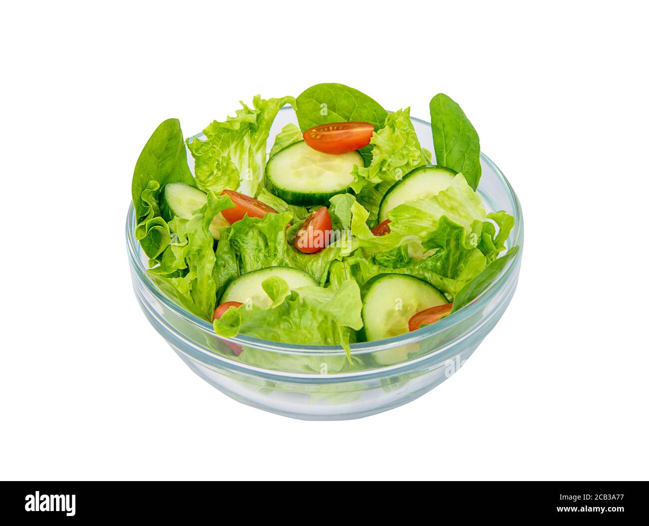 Green salad in a transparent bowl, isolated on white Stock Photo Alamy